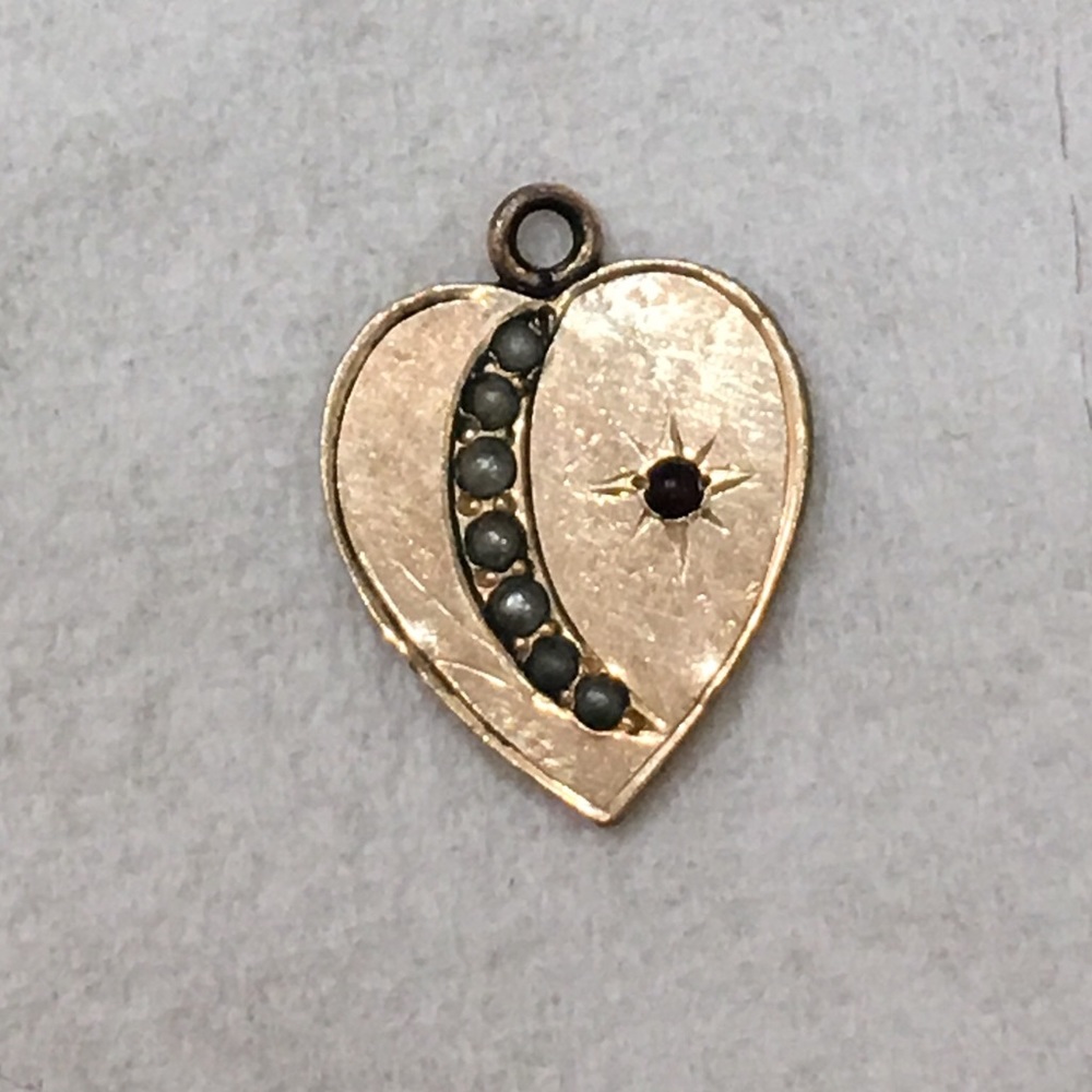 Rose gold charm.